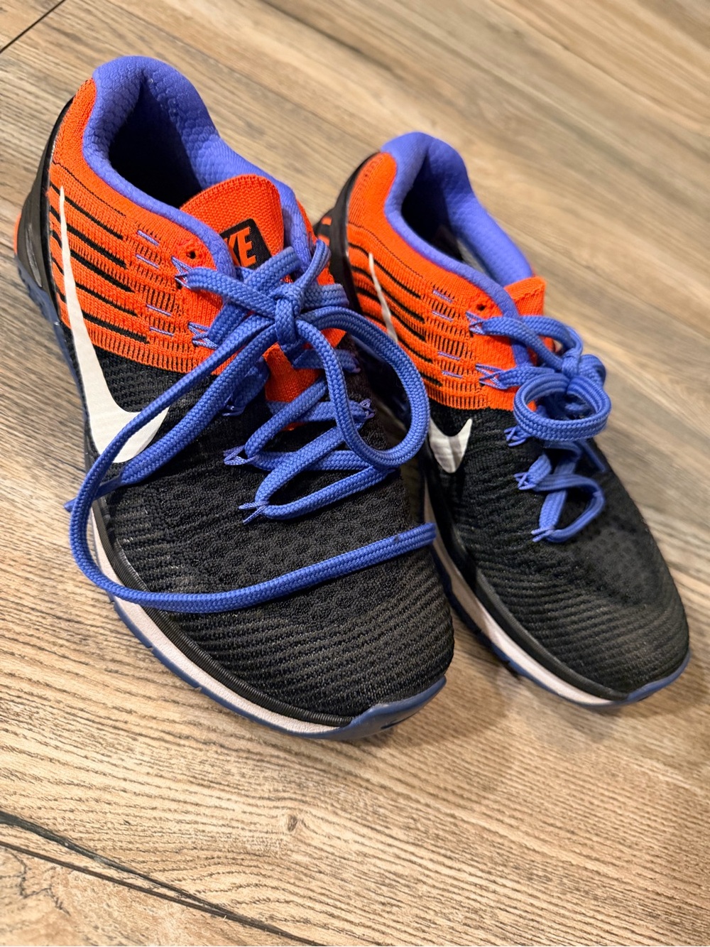 Nike Kids Black Sneakers with Orange Upper and Blue Accents
